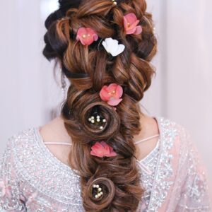 Stunning elegant braid adorned with pink and white flowers, perfect for bridal looks.