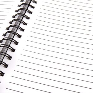 Open spiral notebook with lined pages, perfect for notes and planning.