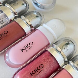 pexels-photo-27854508-27854508 Elegant Kiko Milano lip gloss array featuring diverse pink tones and sleek packaging.